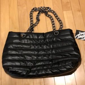 Black quilted shoulder bag with crossbody by Think Royln